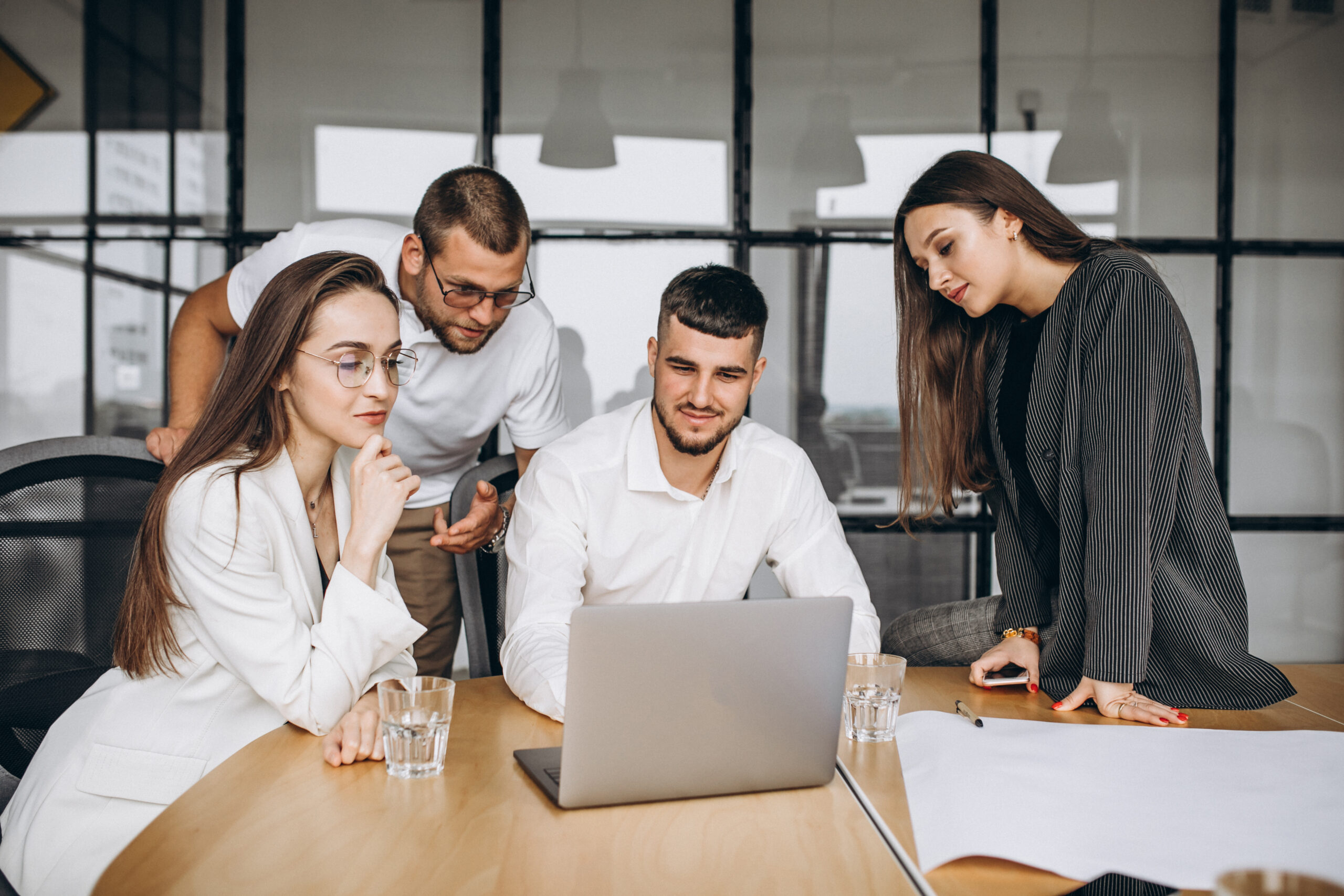 Group of people working out business plan in an office